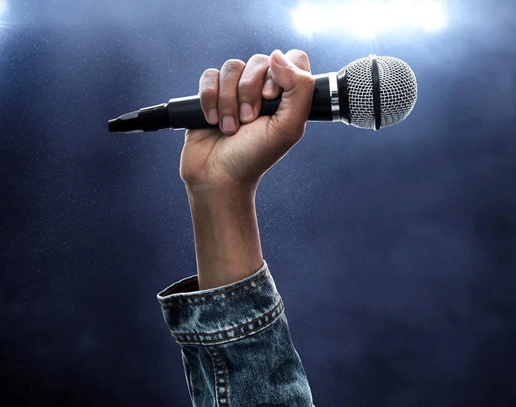 a person holding a microphone